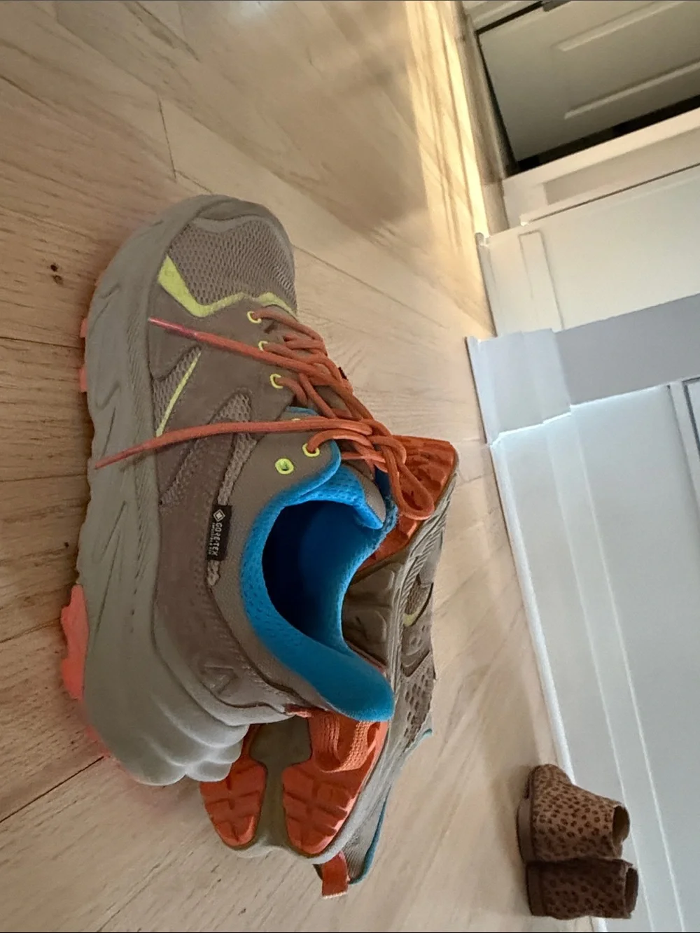 Hoka Kids Tan Sneakers with Bright Blue Lining and Orange Laces
